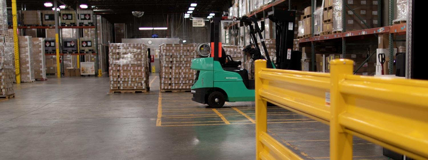 Mitsubishi Forklift Amidst Merchandise in a Warehouse