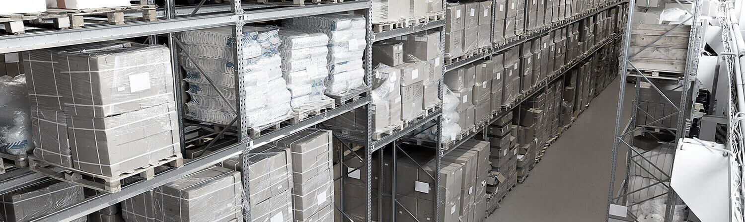 Background image of gray-toned warehouse aisle with bags